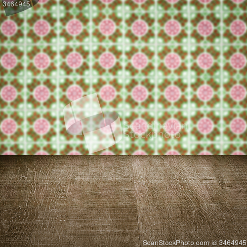 Image of Wood table top and blur vintage ceramic tile pattern wall