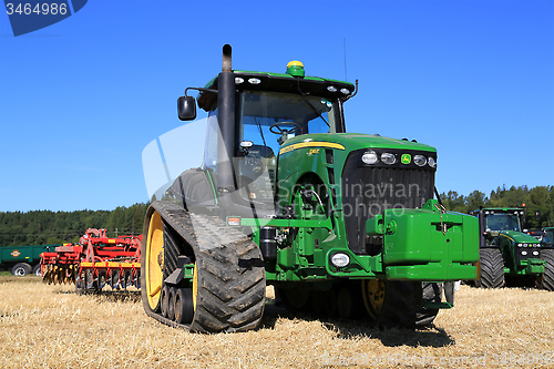 Image of John Deere 8345RT Track Tractor and Vaderstad Cultivator on Fiel