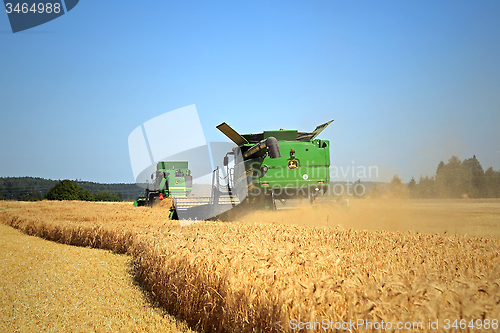 Image of Two John Deere Modern Combines Harvest Barley