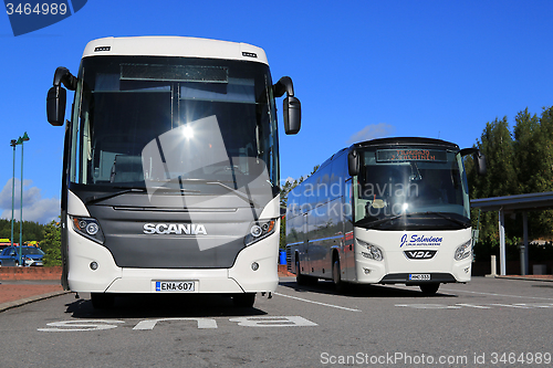Image of White Scania Touring and VDL Futura Coach Buses