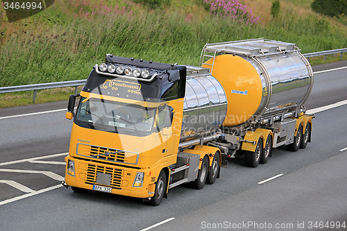 Image of Yellow Volvo FH Tank Truck Transports Food on Motorway