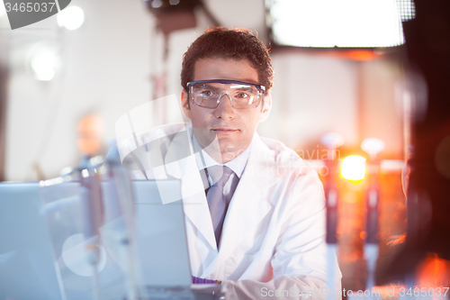 Image of Portrait of an engineer in his working environment.