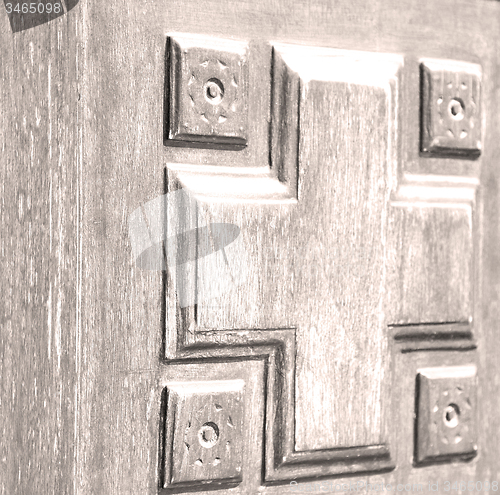 Image of texture of a brown old door in italy europe