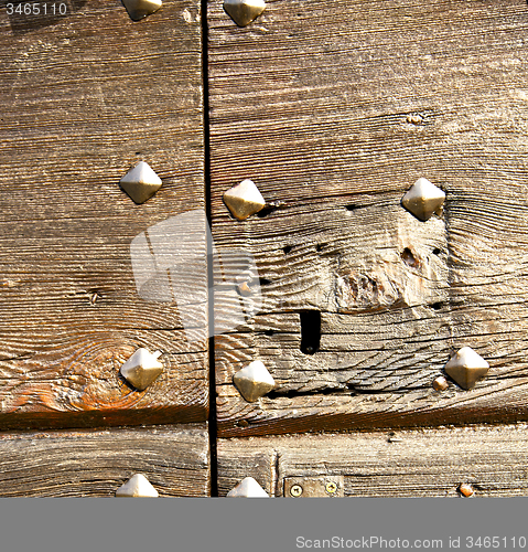 Image of  capronno      rusty brass   a  door curch  closed wood italy  l