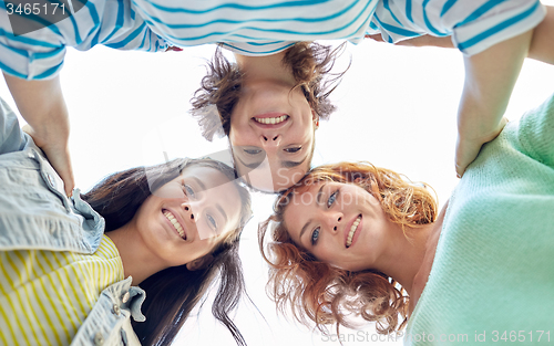 Image of happy young women or teenage girls on city street