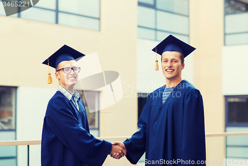 Image of smiling students in mortarboards