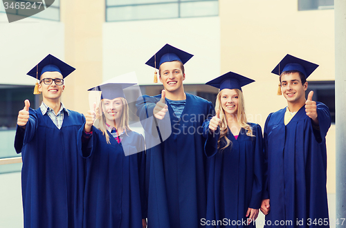 Image of group of smiling students in mortarboards