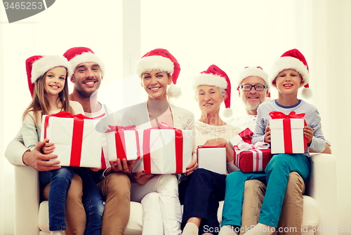 Image of happy family sitting on couch at home