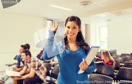 Image of group of smiling students in lecture hall