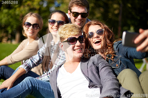 Image of students or teenagers with smartphone at campus