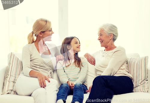 Image of smiling family at home