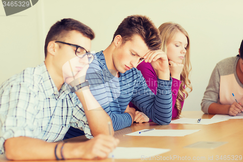 Image of group of students with papers