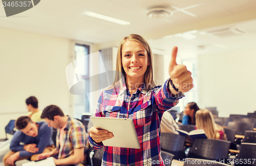 Image of group of smiling students with tablet pc