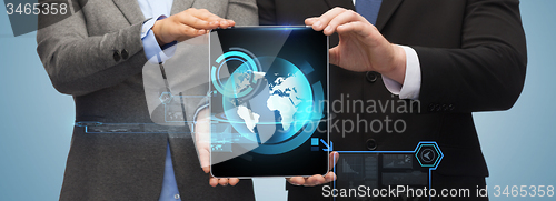 Image of businessman and businesswoman with tablet pc