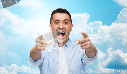 Image of scared man shouting and pointing finger on you