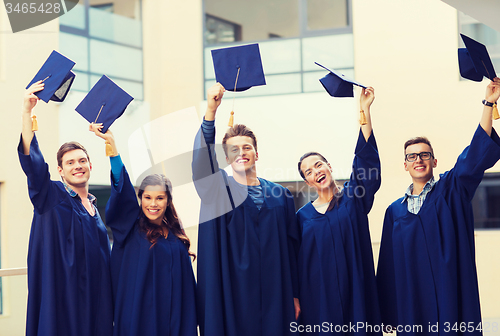 Image of group of smiling students in mortarboards