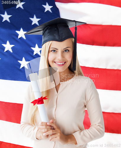 Image of student in graduation cap with certificate