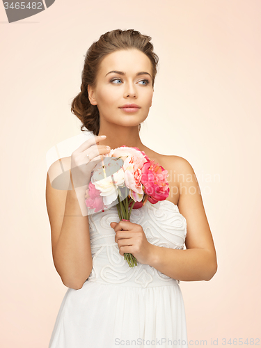 Image of woman with bouquet of flowers