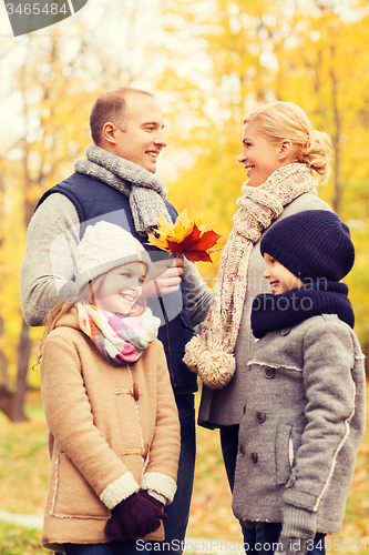 Image of happy family in autumn park