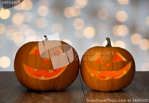 Image of close up of carved halloween pumpkins on table