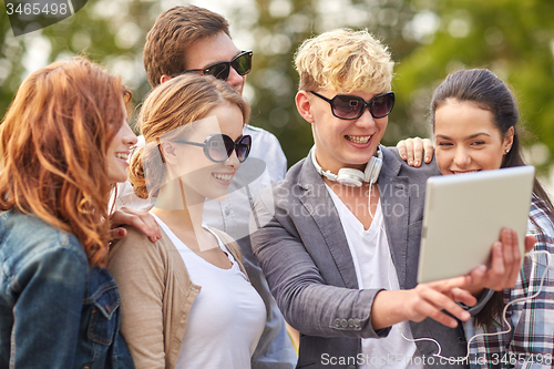 Image of students or teenagers with tablet pc taking selfie