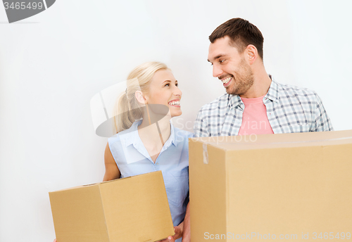 Image of couple with cardboard boxes moving to new home