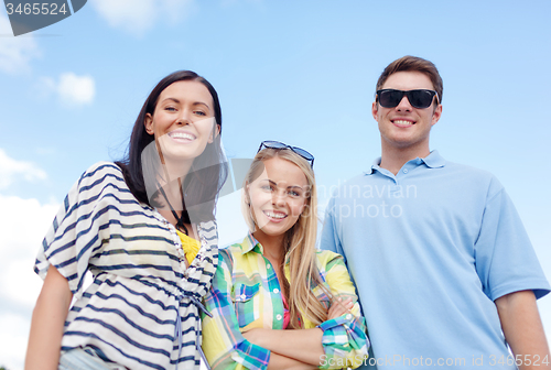 Image of group of happy friends on beach