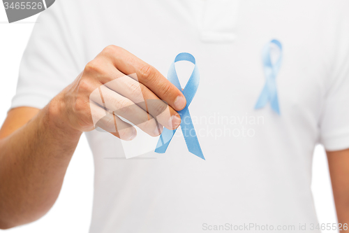 Image of hand with blue prostate cancer awareness ribbon