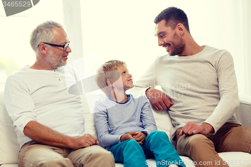 Image of smiling family at home