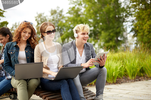 Image of students or teenagers with laptop computers