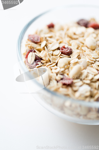 Image of close up of bowl with granola or muesli on table