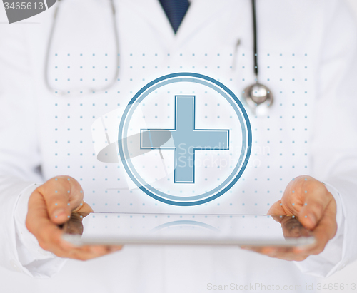 Image of male doctor with stethoscope holding tablet pc