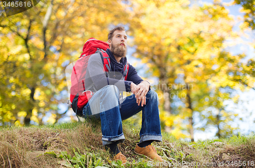 Image of man with backpack hiking