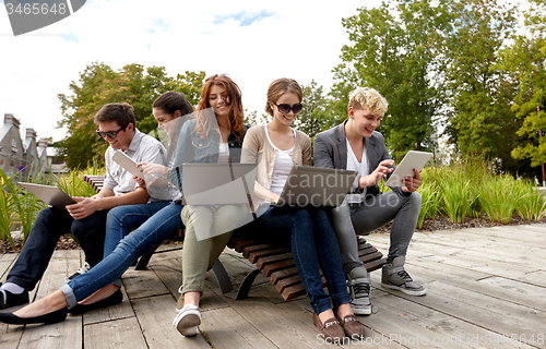 Image of students or teenagers with laptop computers