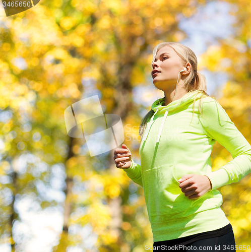 Image of woman doing running outdoors