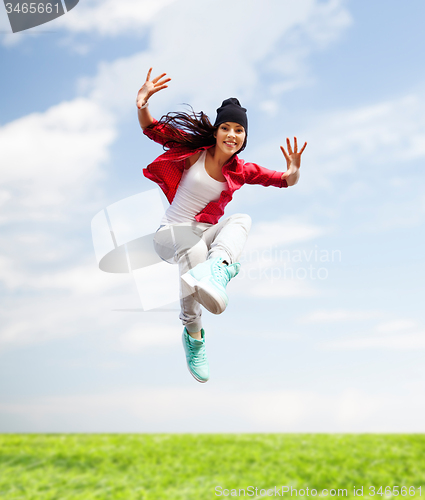 Image of beautiful dancing girl jumping