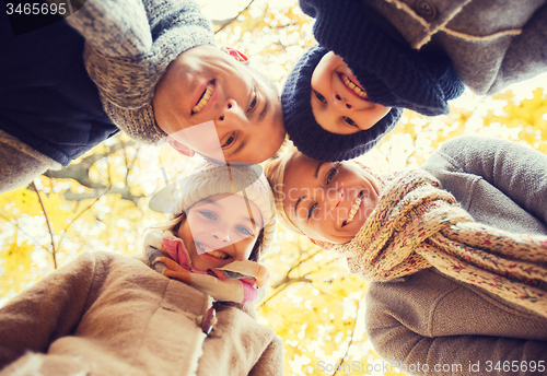 Image of happy family in autumn park