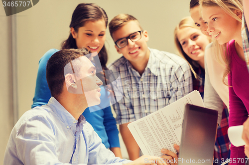 Image of group of students and teacher with laptop