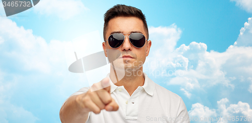 Image of man in sunglasses pointing finger on you