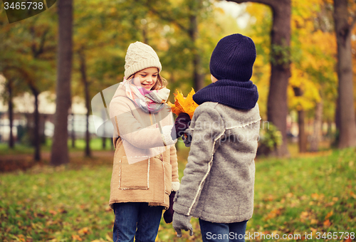 Image of smiling children in autumn park