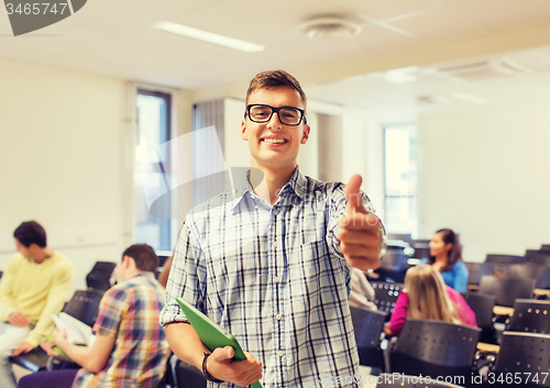 Image of group of smiling students in lecture hall
