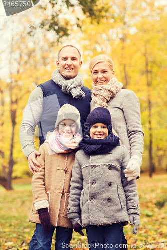 Image of happy family in autumn park
