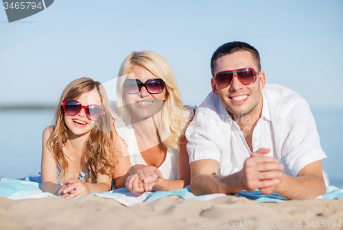 Image of happy family on the beach