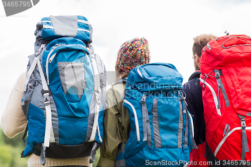 Image of group of friends with backpacks hiking