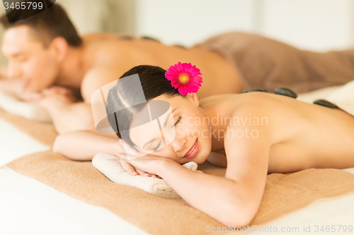 Image of couple in spa with hot stones