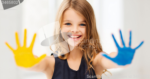 Image of girl showing painted hands