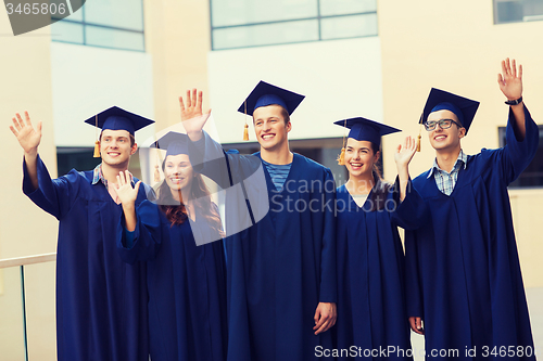 Image of group of smiling students in mortarboards