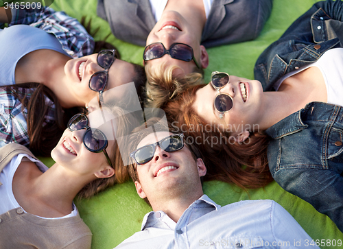 Image of group of students or teenagers lying in circle