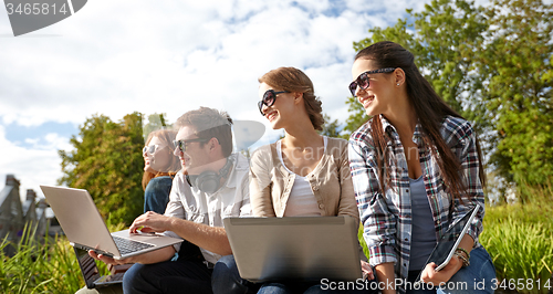 Image of students or teenagers with laptop computers