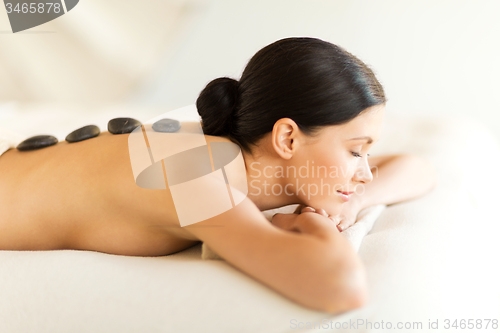 Image of woman in spa with hot stones